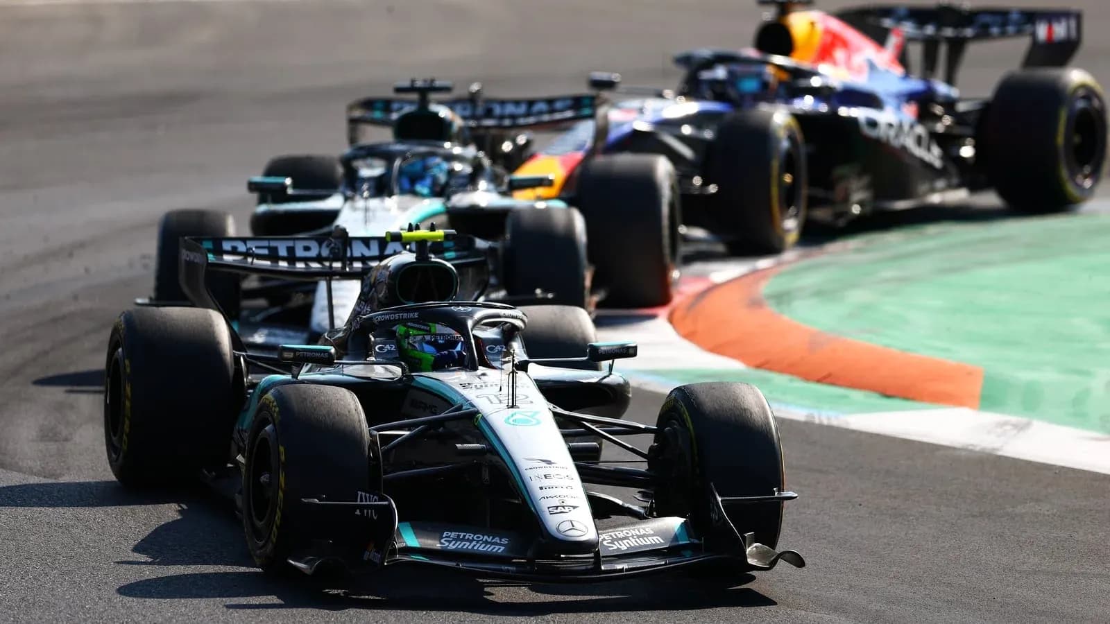 Formula 1 cars racing on track during competition