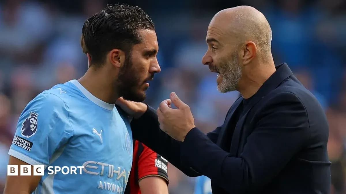 Player receiving instructions from coach on the field