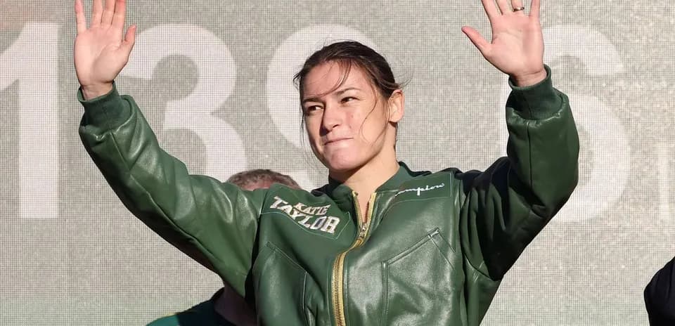 Boxer waving to crowd during event appearance