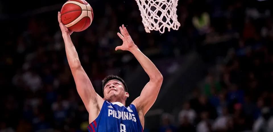 Player shooting the basketball towards the hoop