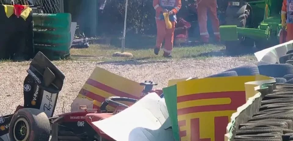 Car crashed into barriers with track officials nearby
