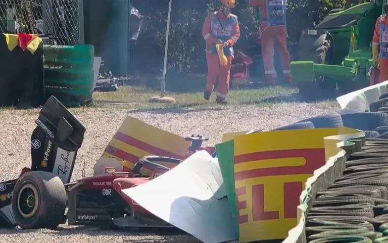 Car crashed into barriers with track officials nearby