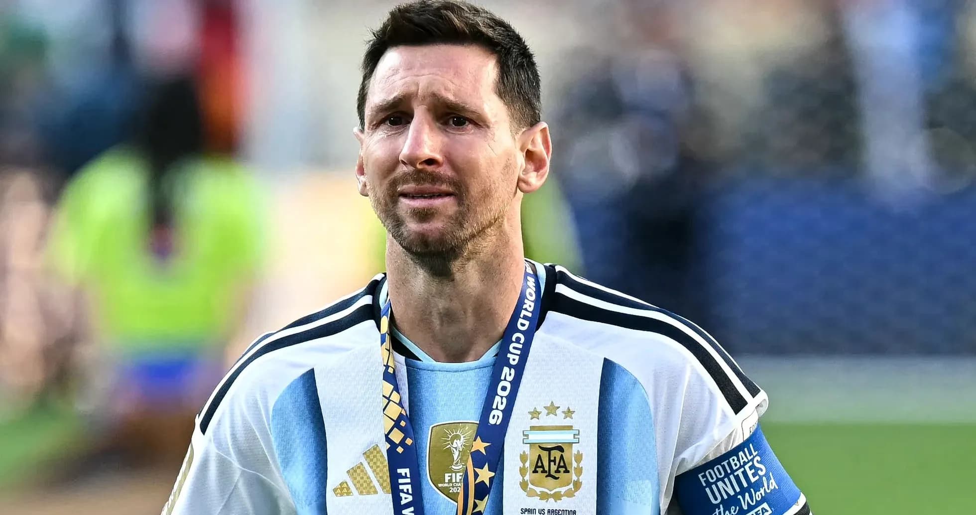 Lionel Messi wearing Argentina jersey with World Cup medal