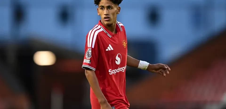 Player wearing Manchester United jersey on the field