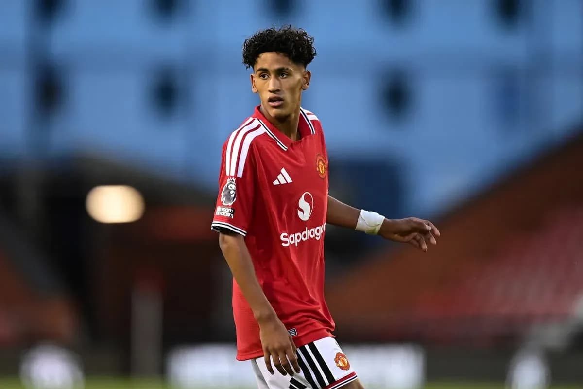Player wearing Manchester United jersey on the field