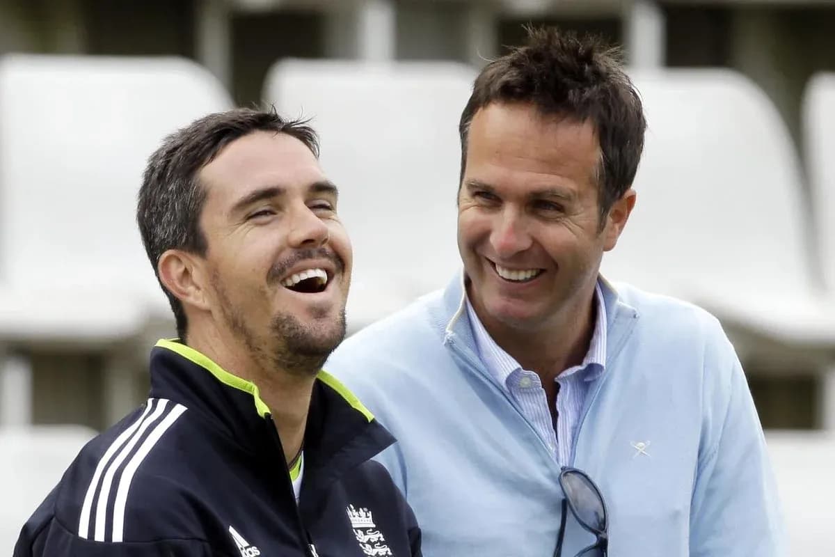 Two men laughing together at a cricket venue
