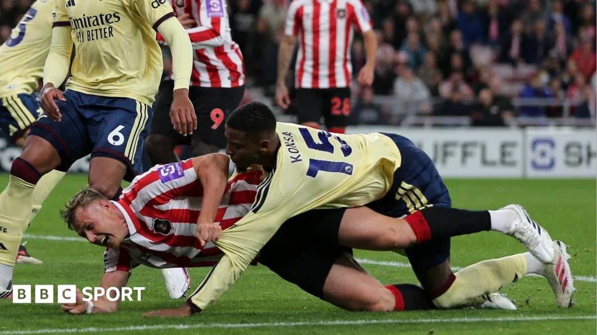 Players engaged in a tackle during a match
