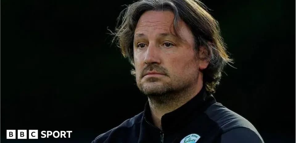 Coach observing during training session at dusk