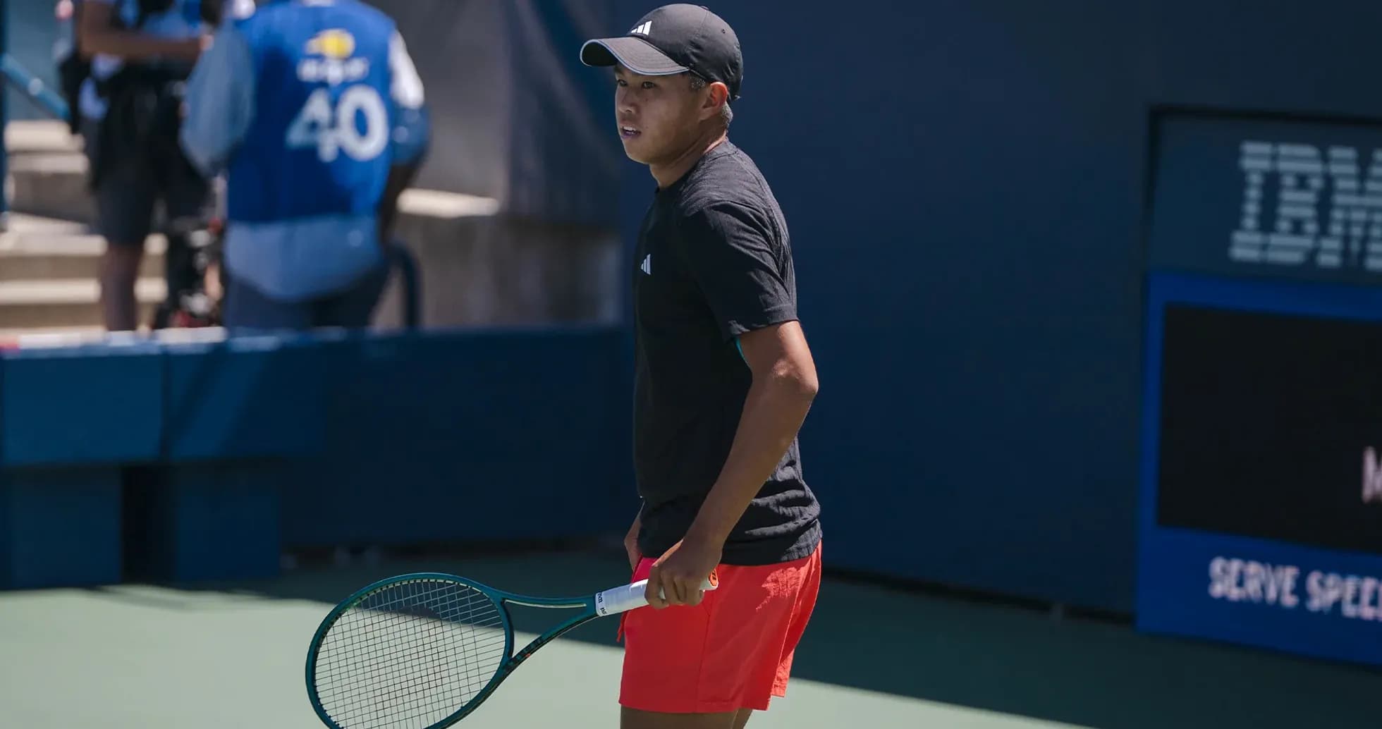 Tennis player preparing on court with racket