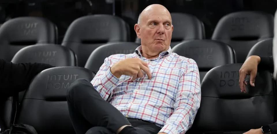 Man sitting in arena seats during a game