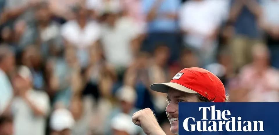 Player celebrating victory with raised fist in crowd