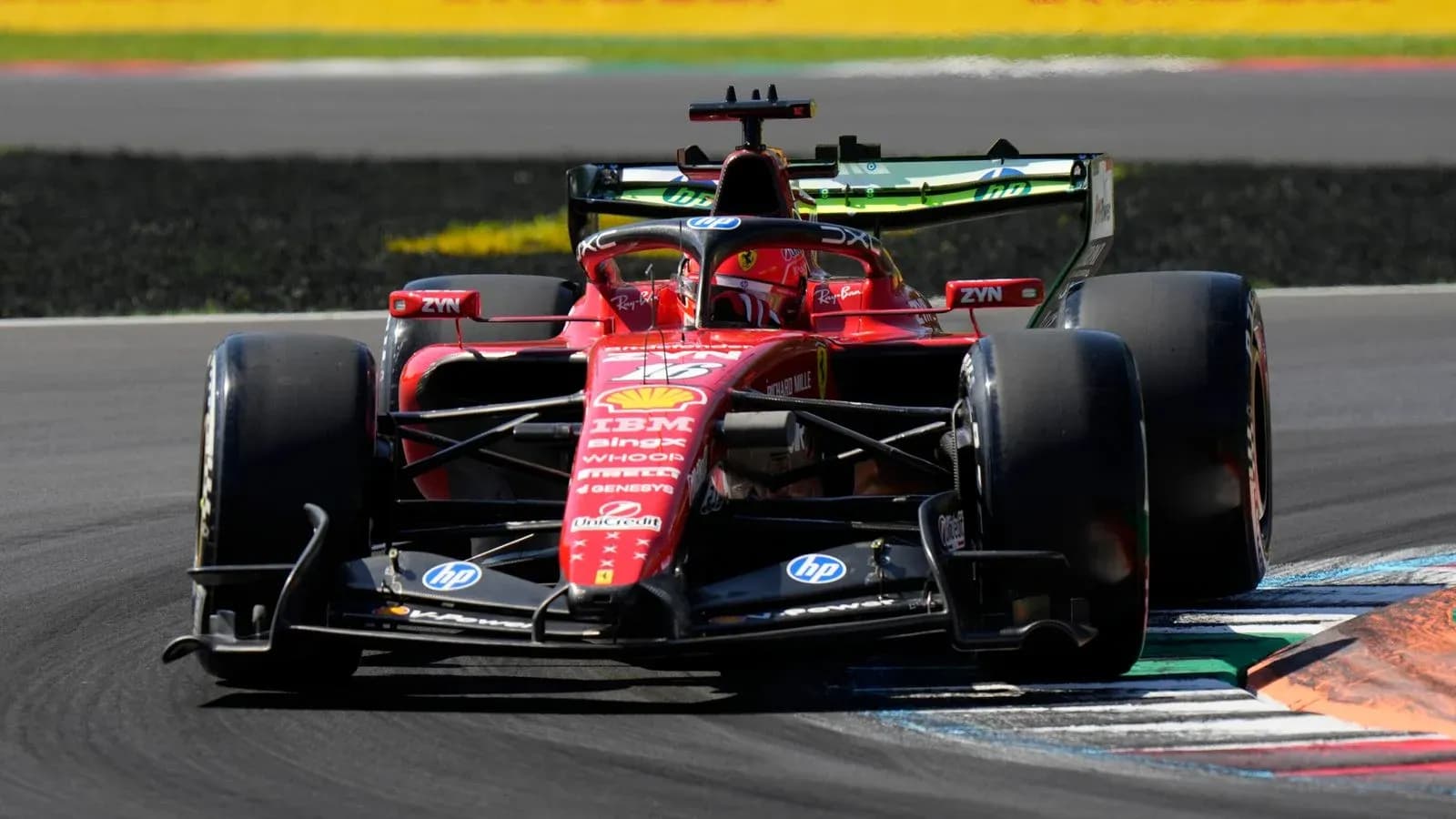 Ferrari Formula 1 car navigating a corner on track