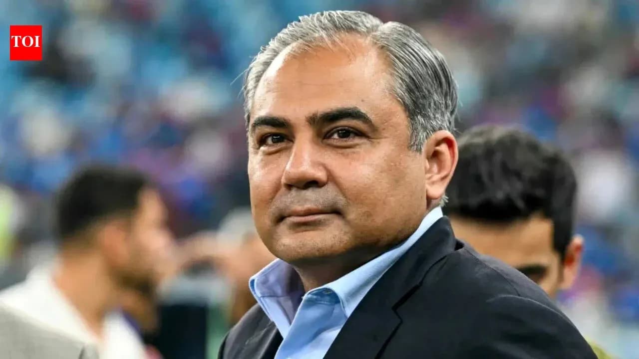 Man in suit at sporting event background