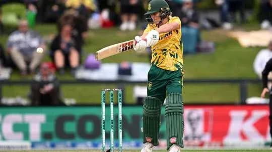 Batter striking the ball during cricket match