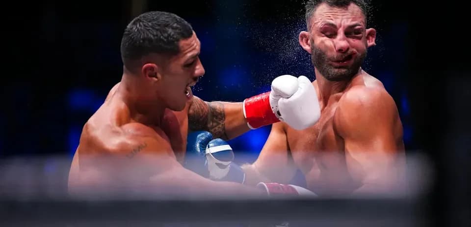 Boxers exchanging punches in a boxing match