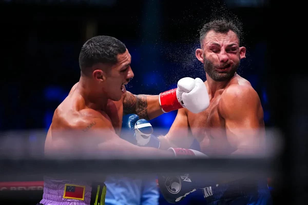 Boxers exchanging punches in a boxing match