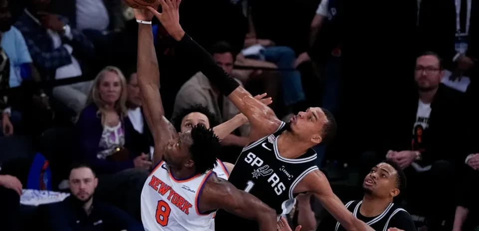 Player attempting a shot while being defended