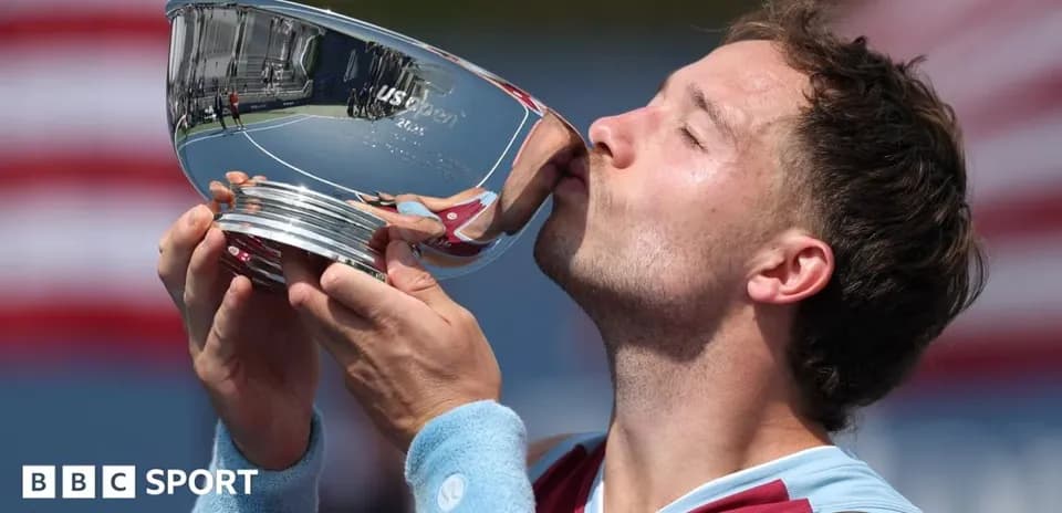 Player kissing trophy after winning US Open