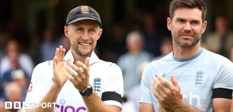 Two cricket players applauding during a match