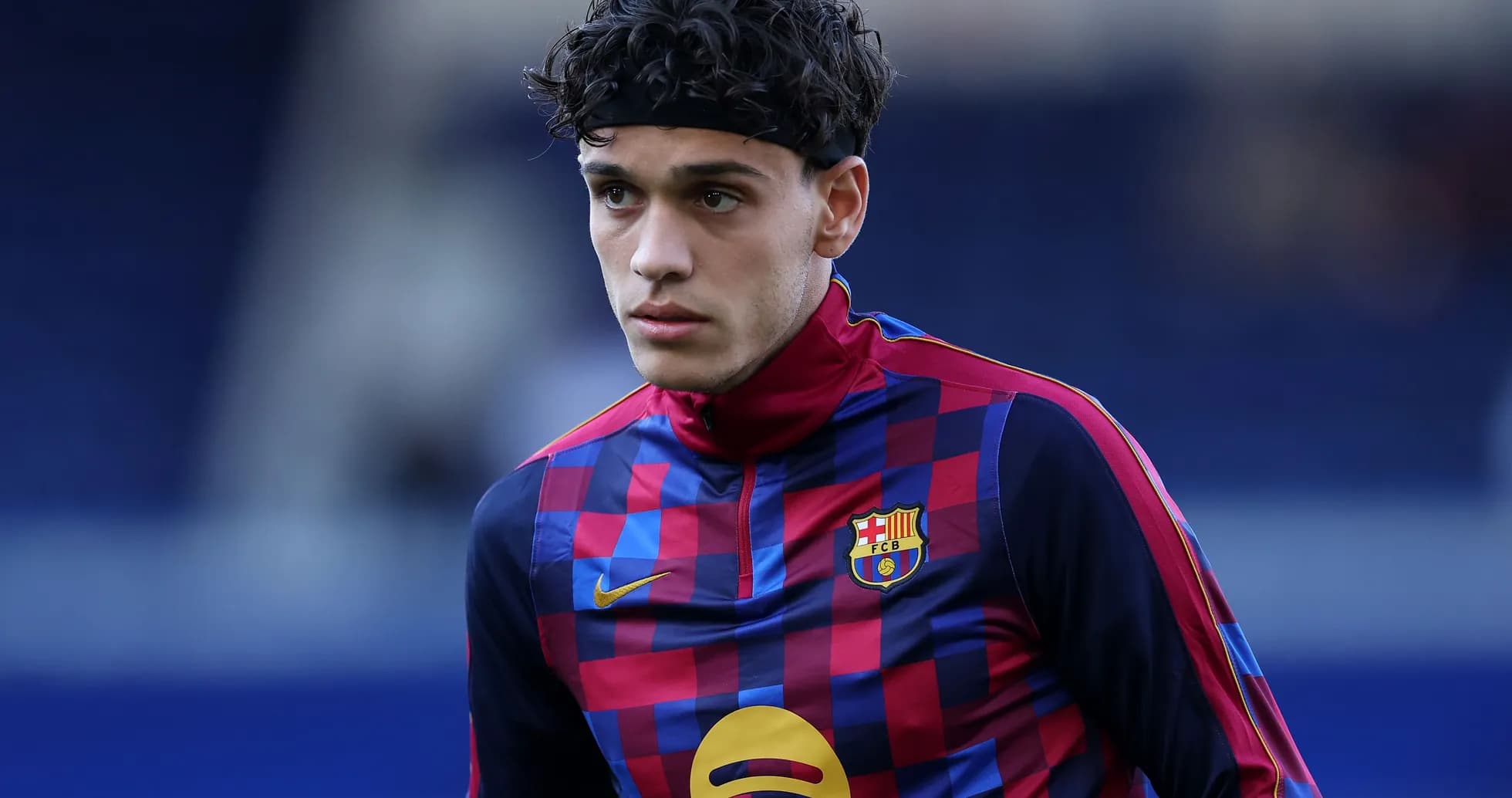 Player in FC Barcelona training kit during warm-up