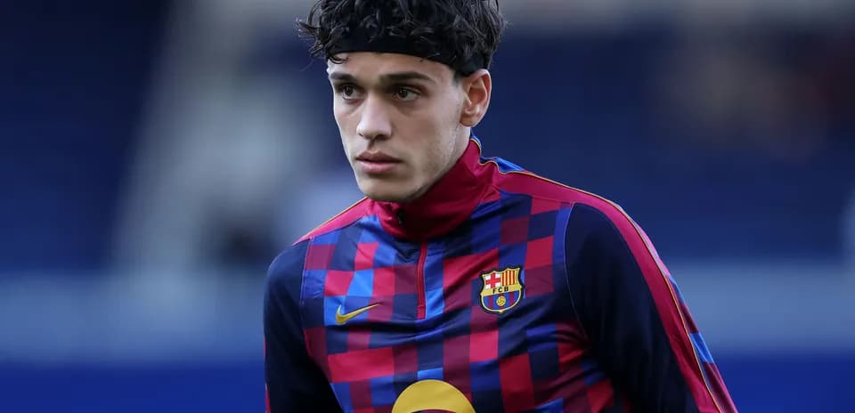 Player in FC Barcelona training kit during warm-up