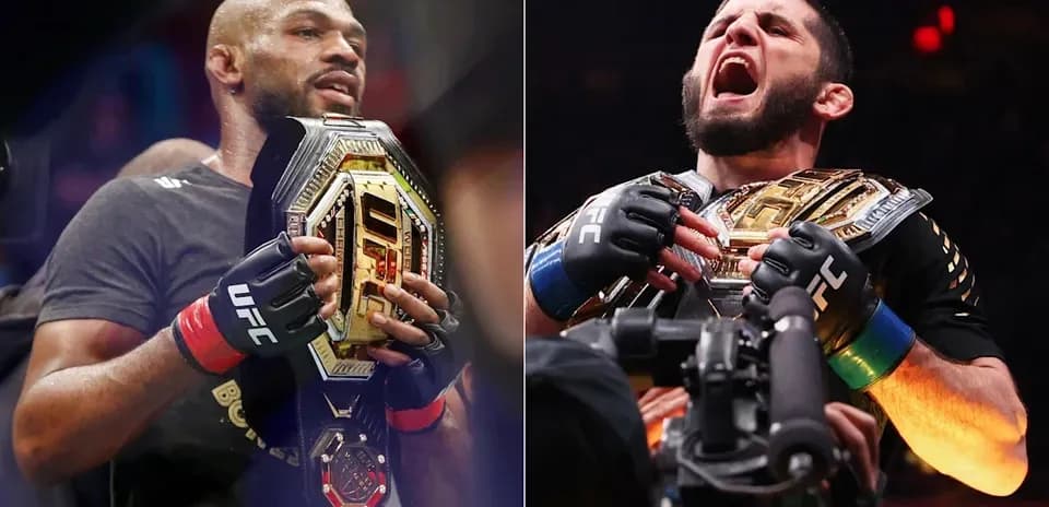 Two UFC champions holding their title belts