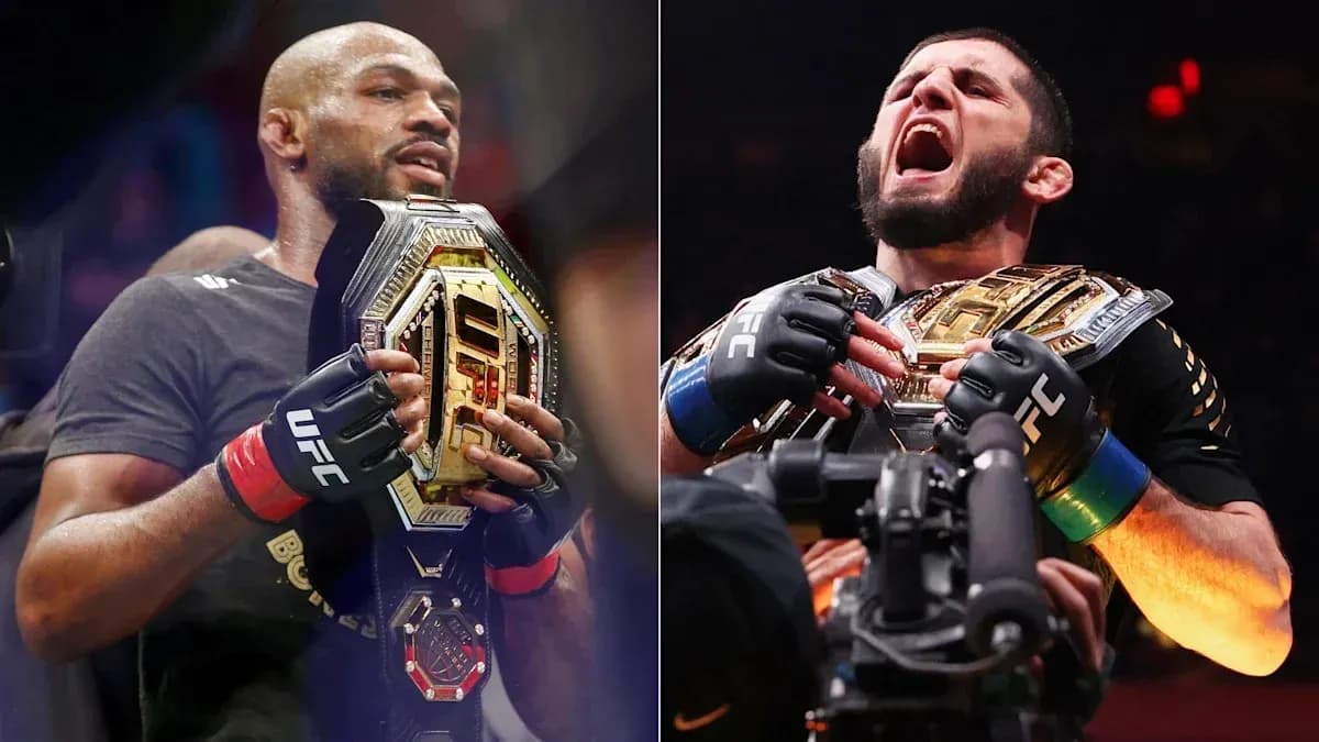 Two UFC champions holding their title belts