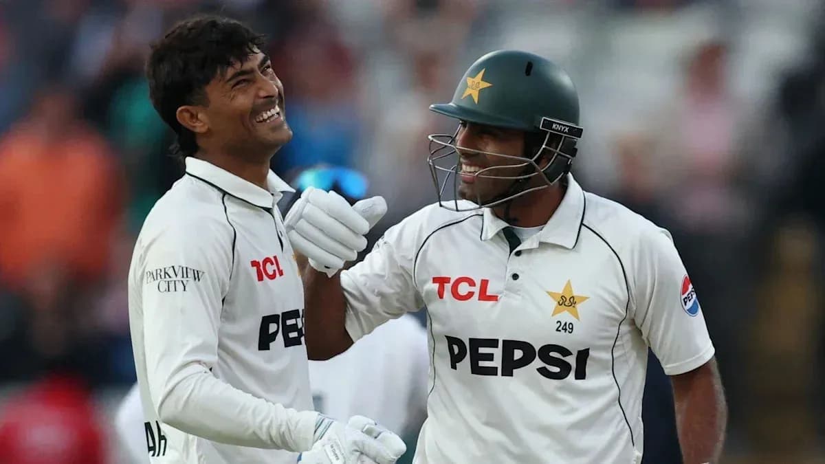 Two Pakistani cricketers celebrating on the field
