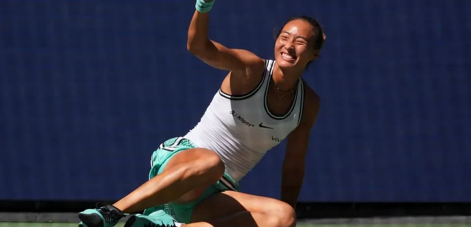 Tennis player celebrating on court after winning point