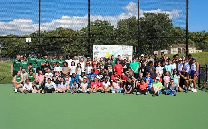 Group photo of participants at tennis event