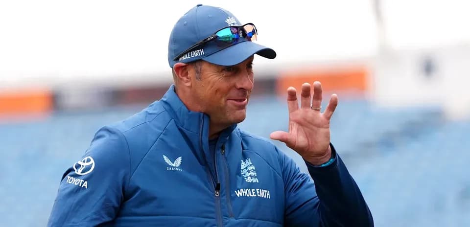 Coach gesturing during practice session outdoors