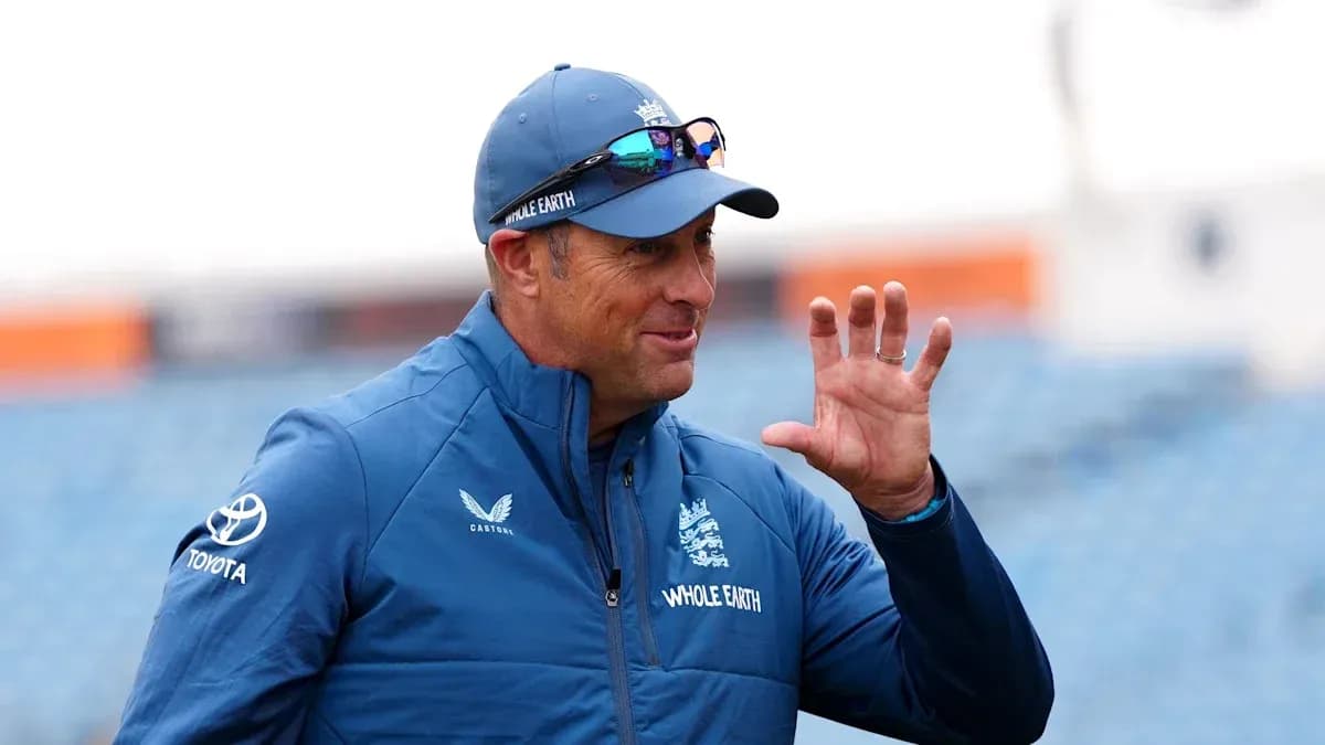 Coach gesturing during practice session outdoors
