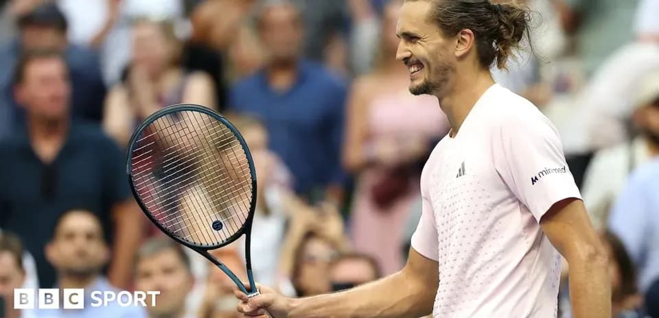 Tennis player celebrating with racket at match
