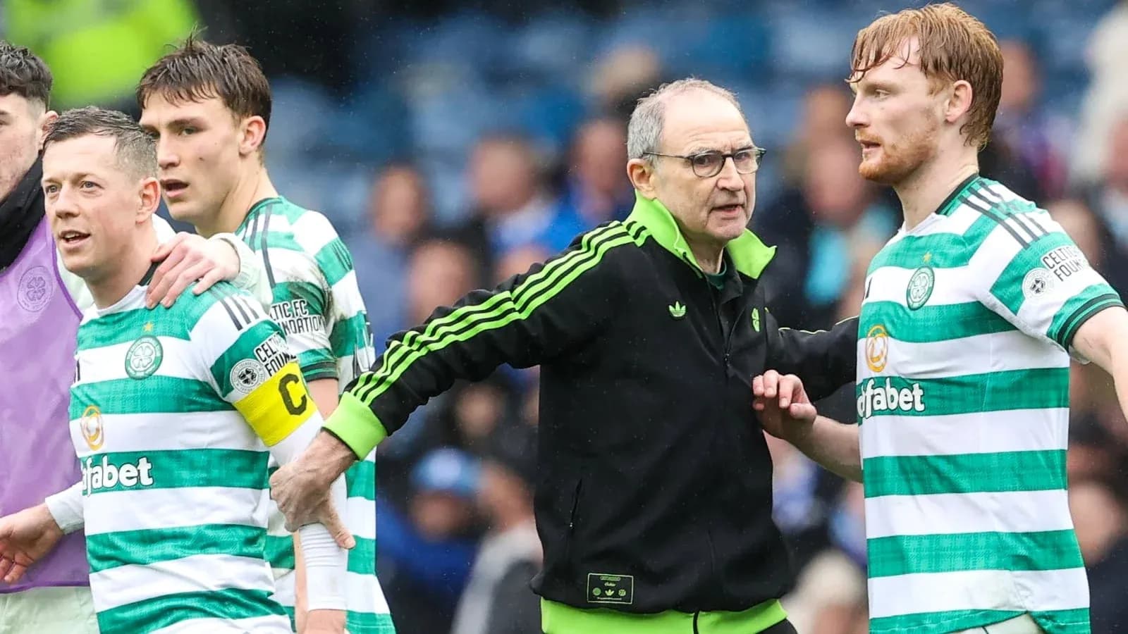 Celtic players and manager during match discussion