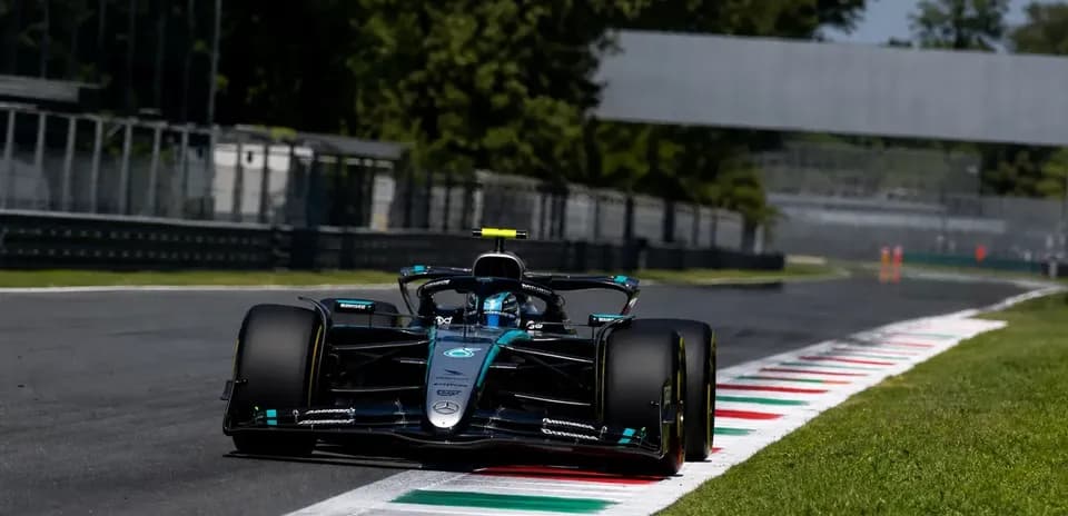Formula 1 car navigating a curve on track