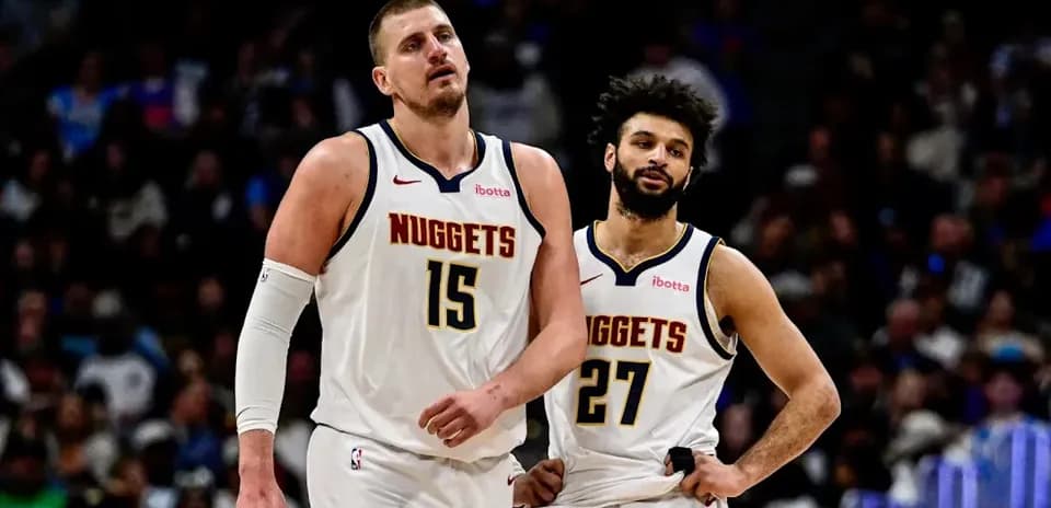 Nuggets players walking off the court during game