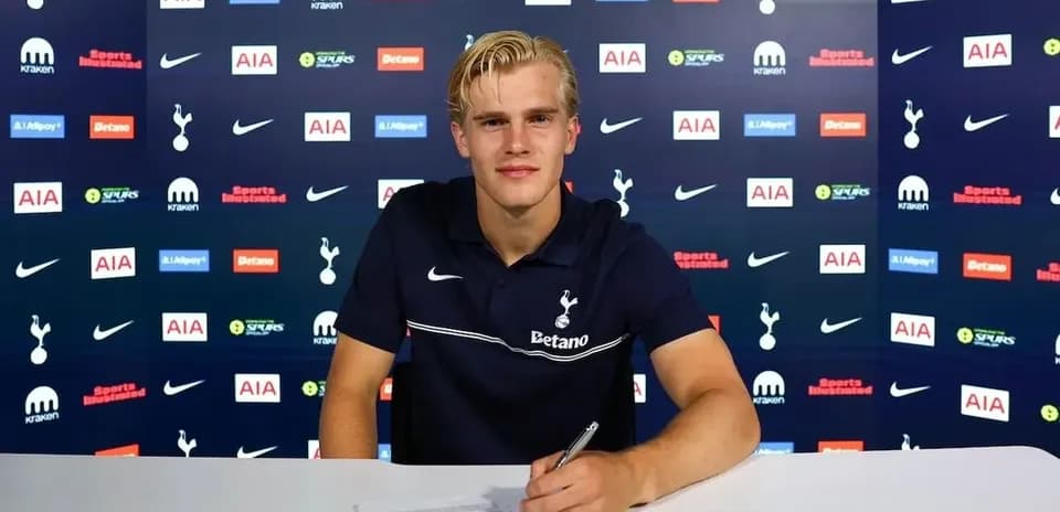 Player signing contract at Tottenham press conference
