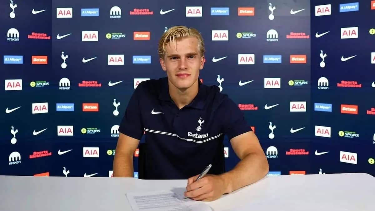 Player signing contract at Tottenham press conference