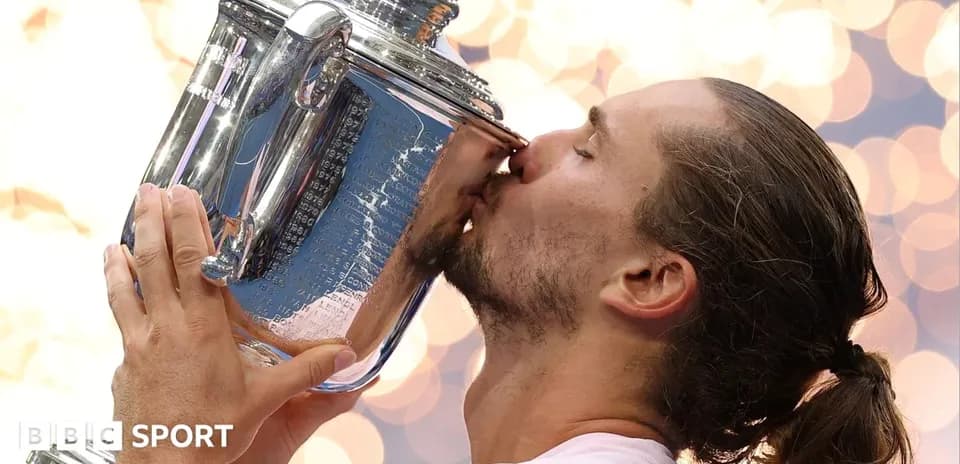 Player kissing trophy after winning tournament