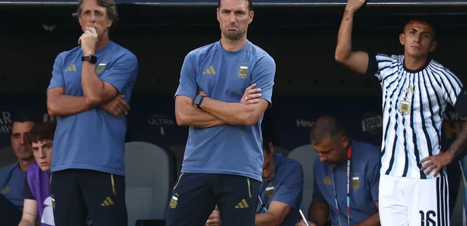 Coaching staff observing match from the bench