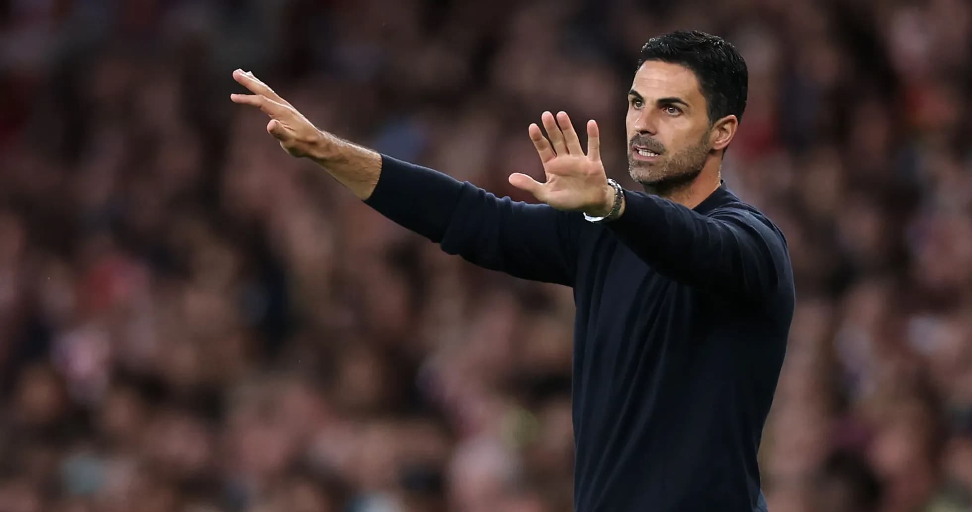 Manager gesturing during a football match