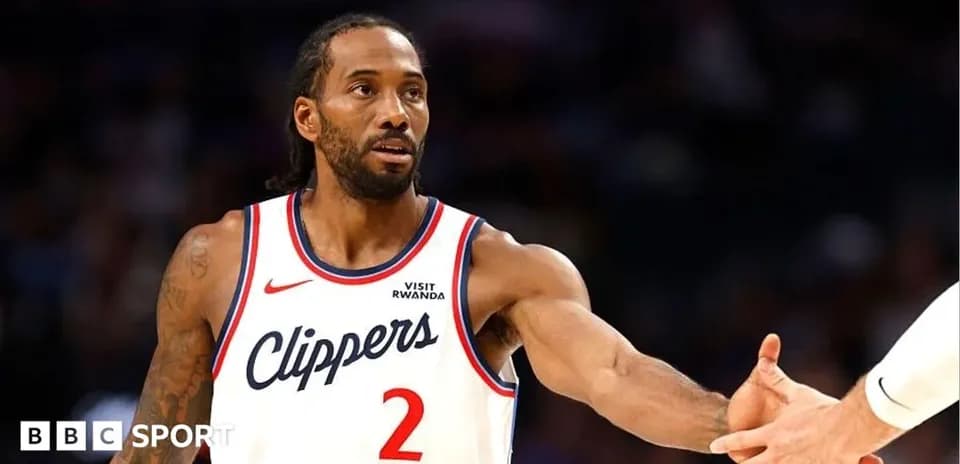 Kawhi Leonard extending hand for handshake on court