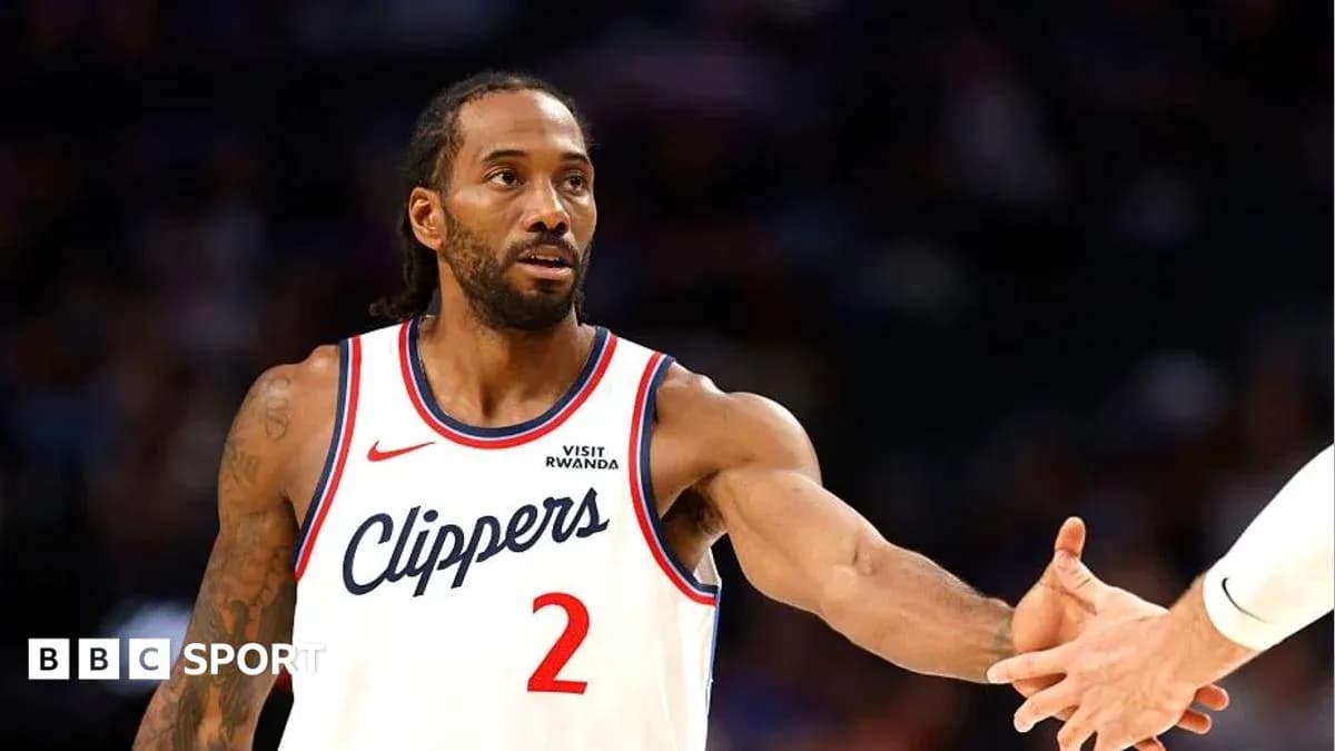 Kawhi Leonard extending hand for handshake on court
