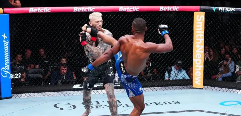 Two fighters competing in an MMA match