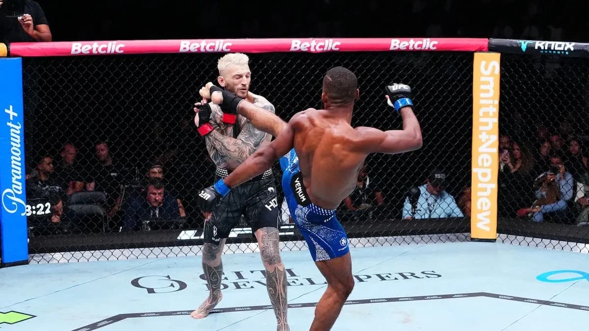 Two fighters competing in an MMA match