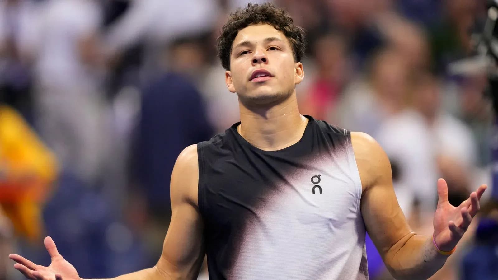 Tennis player reacting during a match on court