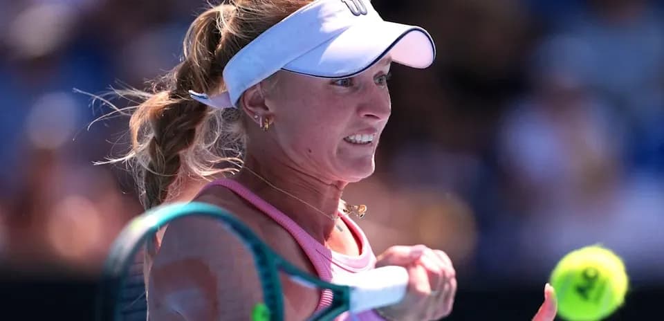 Female tennis player preparing to hit a backhand