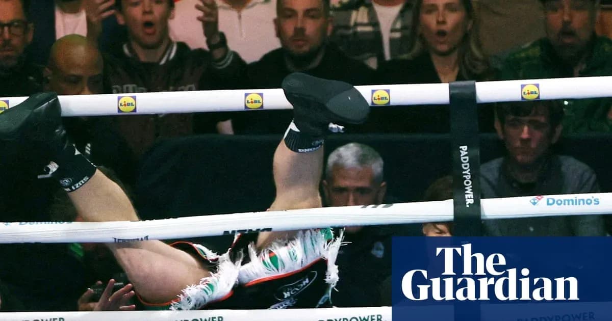 Boxer falling out of the ring during match