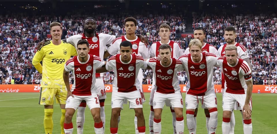 Ajax team posing for photo before a match