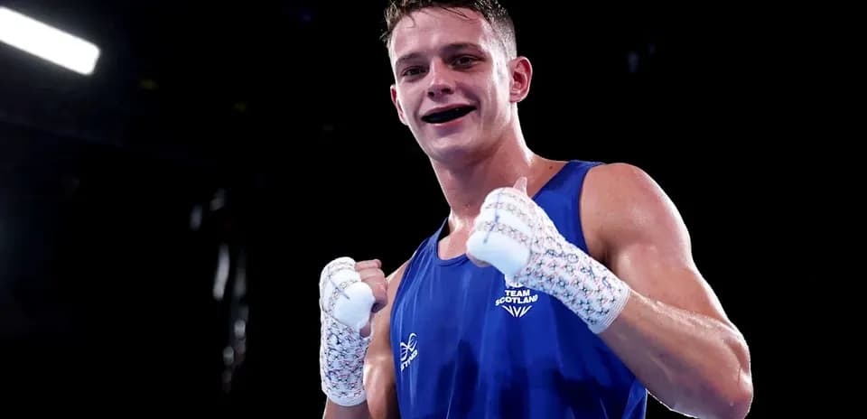 Boxer from Team Scotland celebrating in the ring